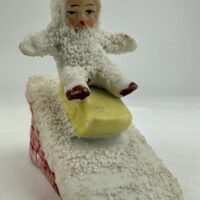 Antique Bisque Snow Baby Sledge